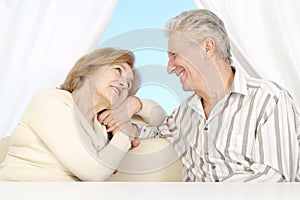 Beautiful Caucasian elderly couple sitting