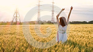 Beautiful caucasian girl at the evening wheat field