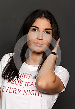 Beautiful caucasian hipster brunette girl posing in studio on isolated background. Trends, style, good time, fashion concept.