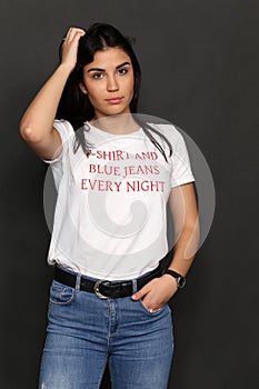 Beautiful caucasian hipster brunette girl posing in studio on isolated background. Trends, style, good time, fashion concept.