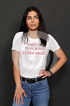 Beautiful caucasian hipster brunette girl posing in studio on isolated background. Trends, style, good time, fashion concept.