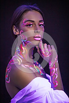 Beautiful caucasian model with fluorescent make-up