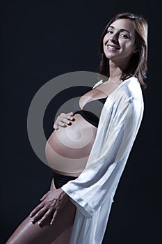 Beautiful caucasian pregnant woman in nightie