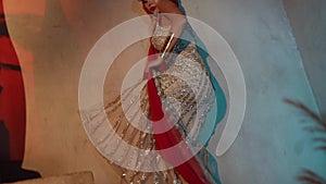 beautiful caucasian is wearing shiny dress and turkish headdress and dancing oriental dance