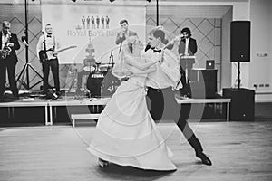 Beautiful caucasian wedding couple just married and dancing their first dance