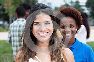 Beautiful caucasian woman with african american girl