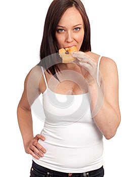 Beautiful caucasian woman eating donut