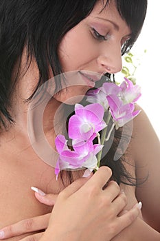 Beautiful Caucasian woman and orchid