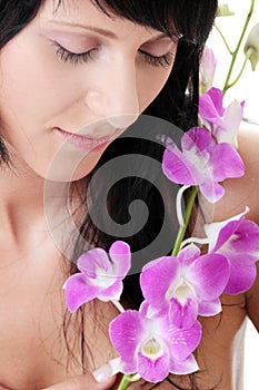 Beautiful Caucasian woman and orchid