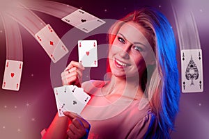 Beautiful caucasian woman with poker cards gambling in casino