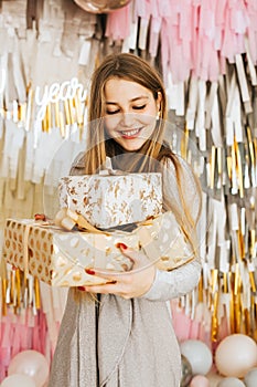 Beautiful Caucasian woman smiles  Christmas presen