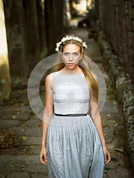 Beautiful Caucasian Woman Walking Down a Stone Path