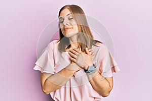 Beautiful caucasian woman wearing casual clothes smiling with hands on chest, eyes closed with grateful gesture on face