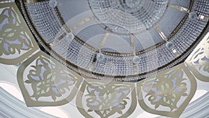 Beautiful ceiling and the large chandelier in Mosque. Scene. Interior of the Muslim place, amazing Islamic architecture.