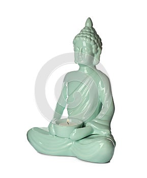 Beautiful ceramic Buddha sculpture with burning candle isolated on white