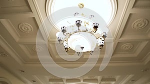 A beautiful Chandelier at a Restaurant. Could also be the Interior of a classy Bar or a Living Room.