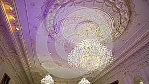 A beautiful Chandelier at a Restaurant. Could also be the Interior of a classy Bar or a Living Room.