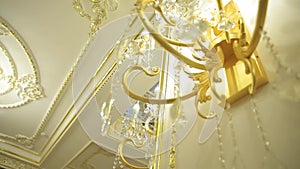 A beautiful Chandelier at a Restaurant. Could also be the Interior of a classy Bar or a Living Room.