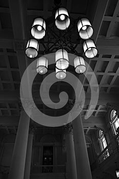 Beautiful chandelier with round shapes at the train station, old architecture photo