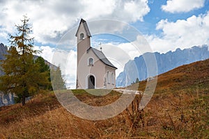 Beautiful chapel of San Maurizio in the mountains, at Passo Gardena pass in the Dolomites, South Tyrol