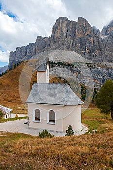 Beautiful chapel of San Maurizio in the mountains, at Passo Gardena pass in the Dolomites, South Tyrol