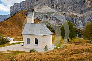 Beautiful chapel of San Maurizio in the mountains, at Passo Gardena pass in the Dolomites, South Tyrol