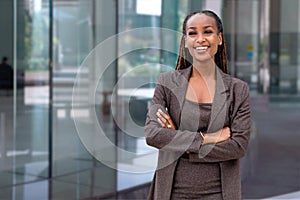 Beautiful cheerful african american executive business woman at the workspace office