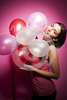 Beautiful cheerful woman with valentines day balloon