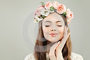 Beautiful Cheerful Young Model Woman Portrait. Perfect Female Face with Clear Skin, Natural Makeup and Pink Roses Flowers