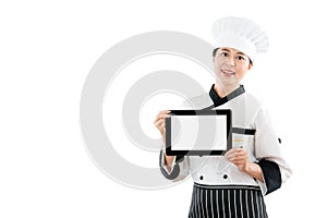 Beautiful chef woman showing digital tablet