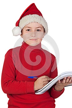 Beautiful child writing his Christmas letter