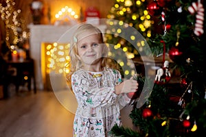 Beautiful children, blond kids, siblings, playing in decorated home for Christmas, enjoying holidays