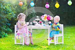 Beautiful children at doll tea party