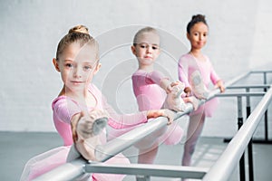 beautiful children looking at camera while stretching