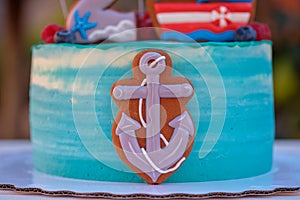 Beautiful children`s cake with a ship anchor