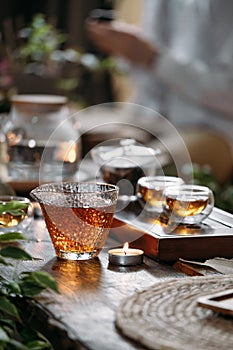 Beautiful chinese tea in teacup with candle flame decoration