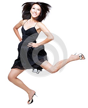 Beautiful Chinese woman jumping up in excitement