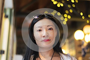 Beautiful Chinese woman smiling indoors
