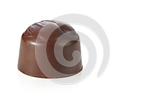 Beautiful chocolate candy without wrapper isolated on white background. Sharpness throughout the frame.