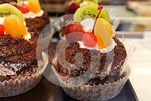 Beautiful chocolate mini cake with candered fruit