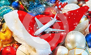 Beautiful christmas background with airplane. Travel concept for christmas and new year. Selective focus