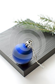 Beautiful Christmas background with copy-space. Blue Christmas ball, New Year`s decorations. Minimalistic postcard