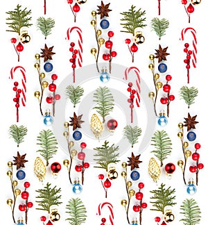 Beautiful Christmas background with red holly berries, lollipop, baubles and green fir branch on white background
