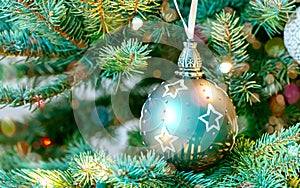 Beautiful christmas ball hanging on christmas tree. winter holiday background