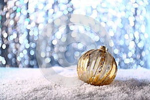 Beautiful Christmas ball on shiny background