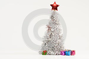 Beautiful Christmas composition with a lush silver Christmas tree and colorful gift boxes