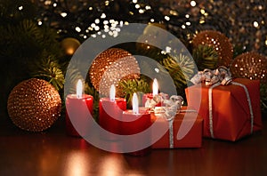 Beautiful christmas decoration with burning red candles and gift box stock images