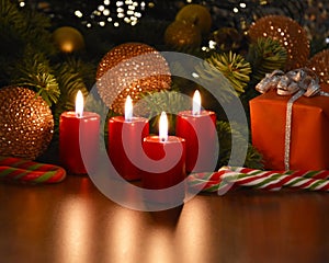 Beautiful christmas decoration with burning red candles and gift box stock images