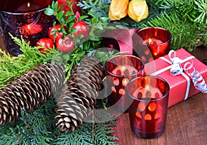 Beautiful christmas decoration with spruce cone, red gift box and candles stock images