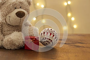 Beautiful christmas decoration, with teddy bear gift package and knitten xmas ball